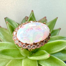 Load image into Gallery viewer, Pre-loved Oval Opal Ring With a Diamond Halo Set in 14ct Yellow Gold