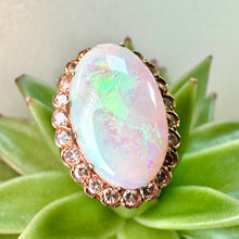 Load image into Gallery viewer, Pre-loved Oval Opal Ring With a Diamond Halo Set in 14ct Yellow Gold