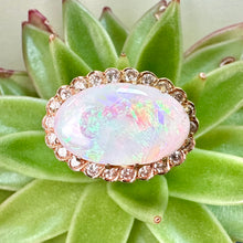 Load image into Gallery viewer, Pre-loved Oval Opal Ring With a Diamond Halo Set in 14ct Yellow Gold