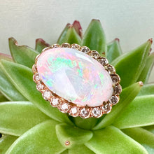 Load image into Gallery viewer, Pre-loved Oval Opal Ring With a Diamond Halo Set in 14ct Yellow Gold