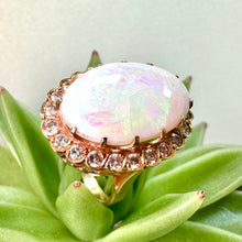 Load image into Gallery viewer, Pre-loved Oval Opal Ring With a Diamond Halo Set in 14ct Yellow Gold