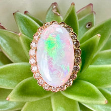 Load image into Gallery viewer, Pre-loved Oval Opal Ring With a Diamond Halo Set in 14ct Yellow Gold