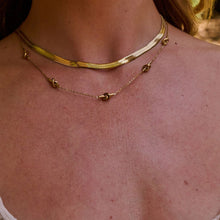 Load image into Gallery viewer, Ava &amp; Sky Stainless Steel Gold Plated Knot Necklace
