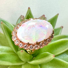 Load image into Gallery viewer, Pre-loved Oval Opal Ring With a Diamond Halo Set in 14ct Yellow Gold
