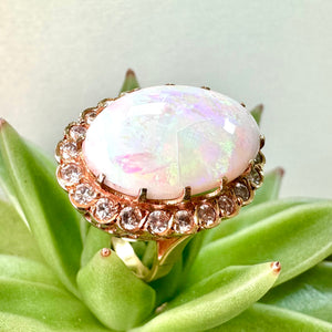 Pre-loved Oval Opal Ring With a Diamond Halo Set in 14ct Yellow Gold